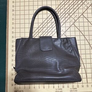 Brown purse with pink lining. Gently used.